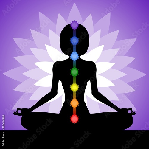 Silhouette of a woman meditating in the lotus position. Yogi girl with chakras. Vector illustration.
