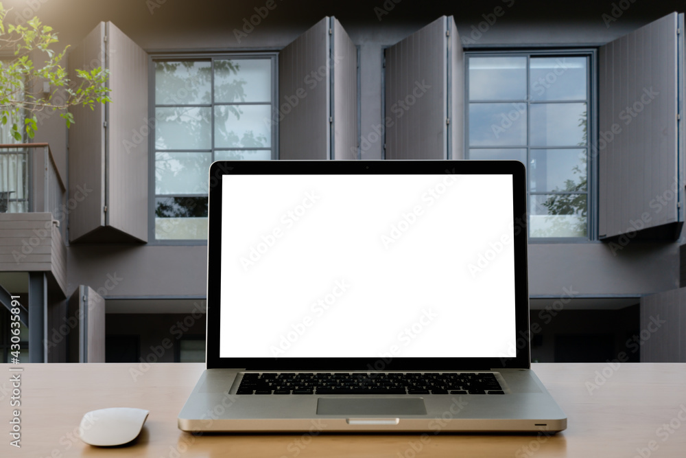 laptop with screen on wood table. laptop with screen on wood table.