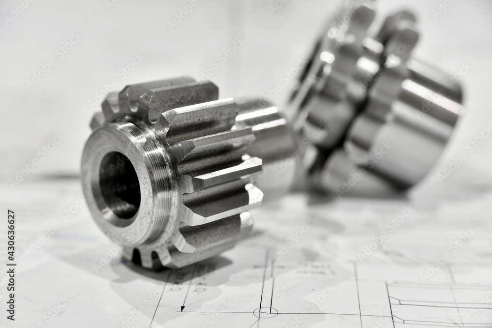 A cogwheel made on a gear cutting machine lies on the technical A cogwheel made on a gear cutting machine lies on the technical