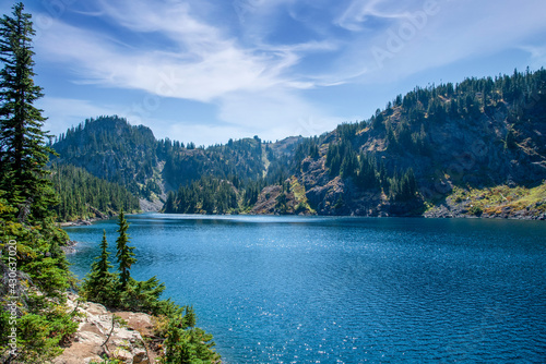 Beautiful pristine alpine wilderness lake under blue skies.