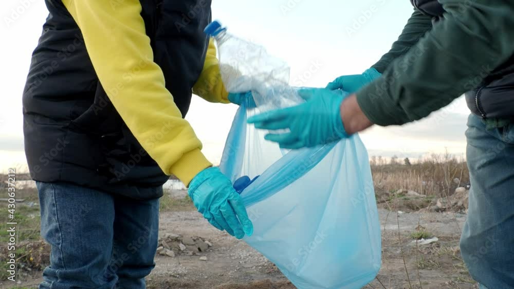 volunteers collect plastic bottles, the concept of ecology of the earth, protection of the planet from garbage volunteers collect plastic bottles, the concept of ecology of the earth, protection of the planet from garbage