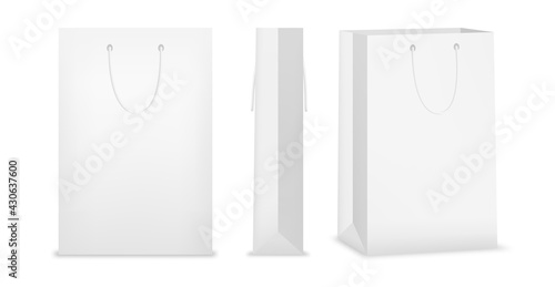 Shopping bag made of white paper. Set of shopping bags with different front and side views, blank mockup with handles, isolated realistic vector illustration