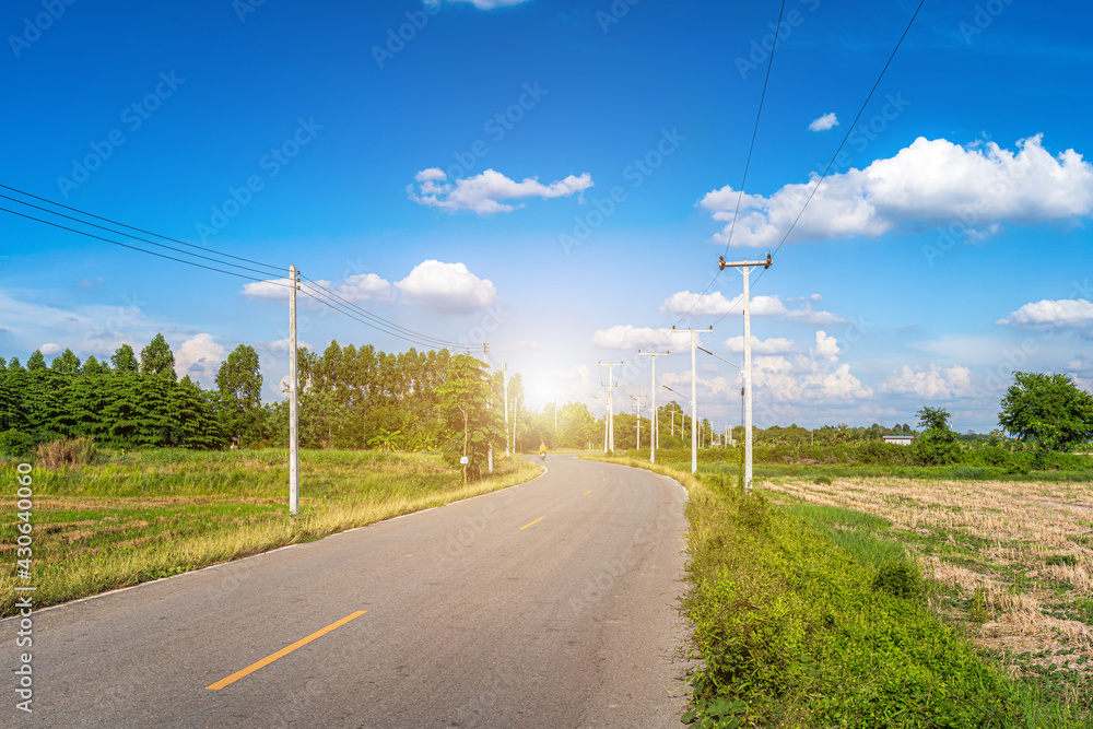 view of asphalt roads countryside Beside with spring nature and tree green in fluffy clouds blue sky daylight background.