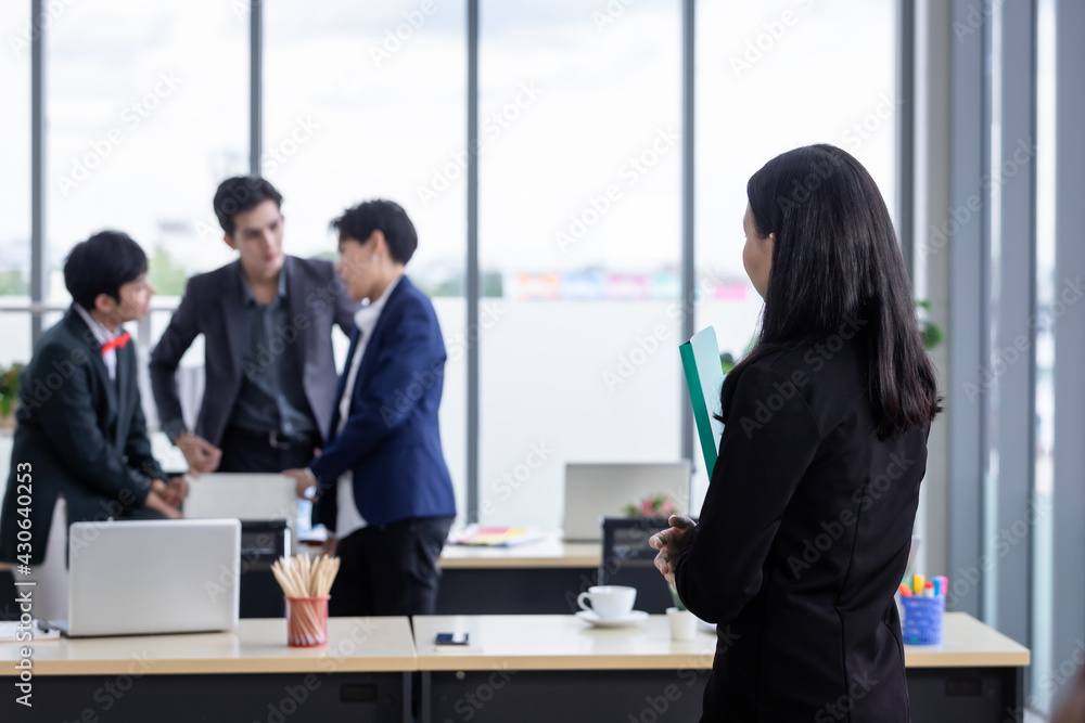 Successful company,executive Young Asian businesswoman with hold file folder with happy workers Group of asian business people with diverse genders (LGBT) in the meeting room at office Successful company,executive Young Asian businesswoman with hold file folder with happy workers Group of asian business people with diverse genders (LGBT) in the meeting room at office