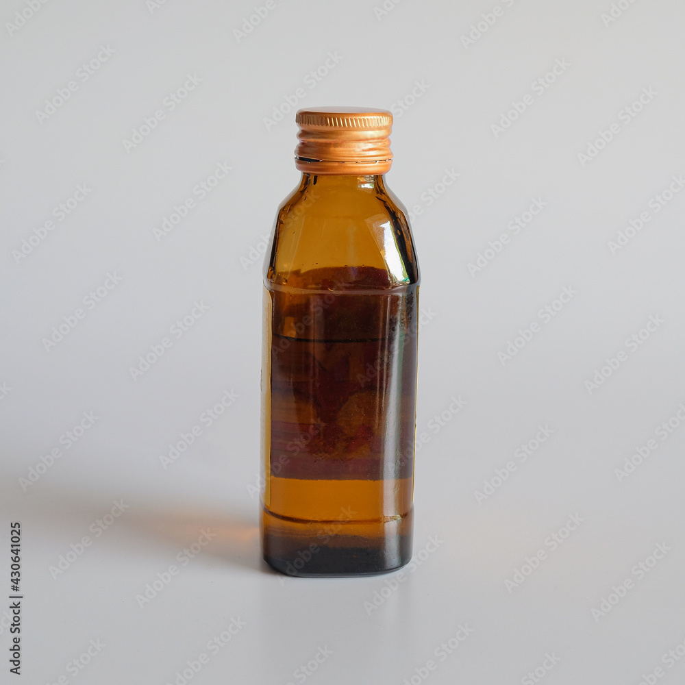 Amber glass cosmetic bottles mockup on white