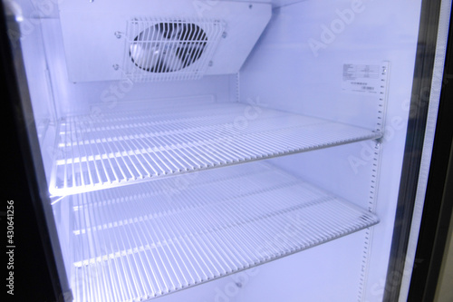 Refrigerator with fan and light bulb.