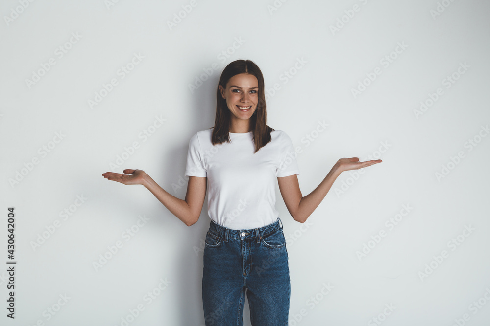 Front view of young woman in jeans and blank white t-shirt Front view of young woman in jeans and blank white t-shirt