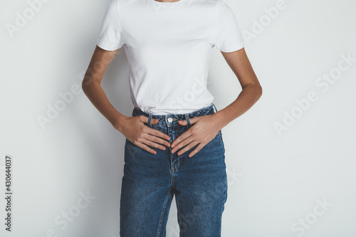 Cropped portrait of young woman in jeans and blank white t-shirt
