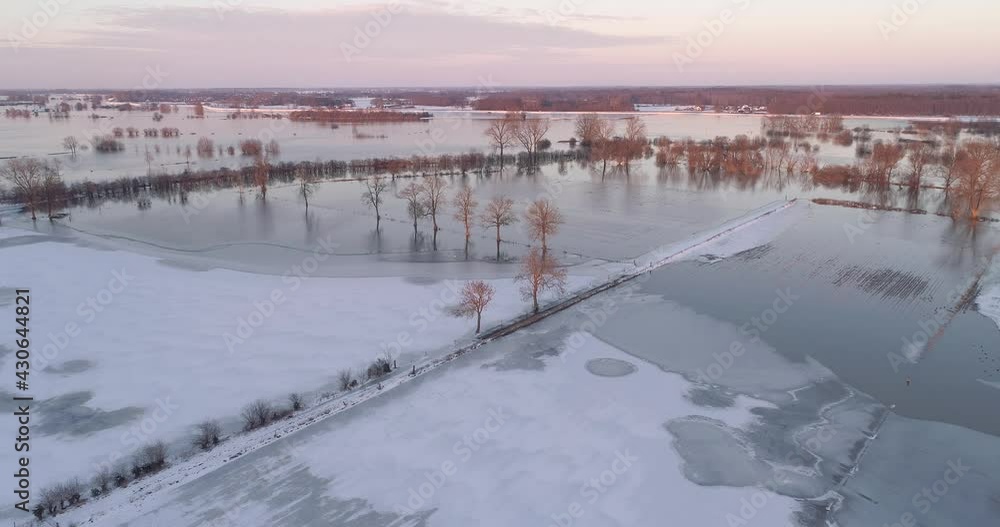 Aerial view of partly frozen flooded flood plains with snow along river IJssel, Overijssel, Netherlands. Aerial view of partly frozen flooded flood plains with snow along river IJssel, Overijssel, Netherlands.