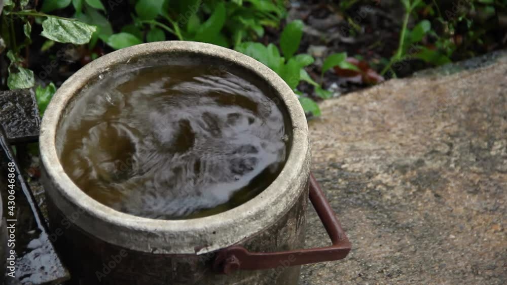 A bucket full of water From the rain water that came down from the roof on a stormy day A bucket full of water From the rain water that came down from the roof on a stormy day