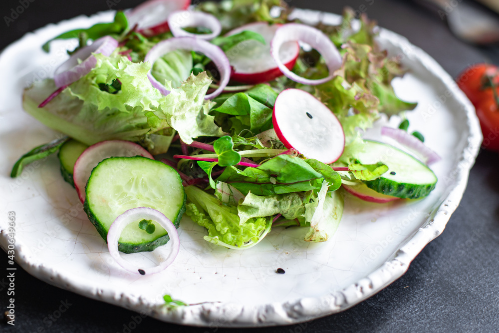 vegetables salad radish, cucumber, mix leaves petals meal snack keto or paleo diet vegan or vegetarian food copy space food background rustic. top view vegetables salad radish, cucumber, mix leaves petals meal snack keto or paleo diet vegan or vegetarian food copy space food background rustic. top view