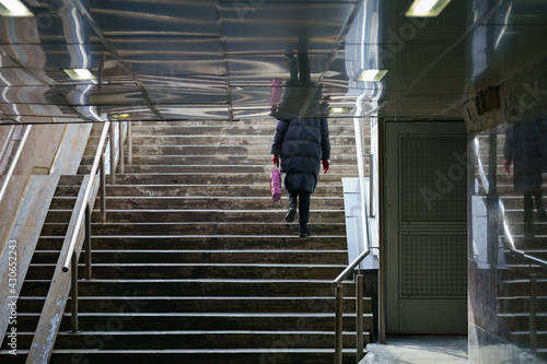 Woman moving up, Urban staircase