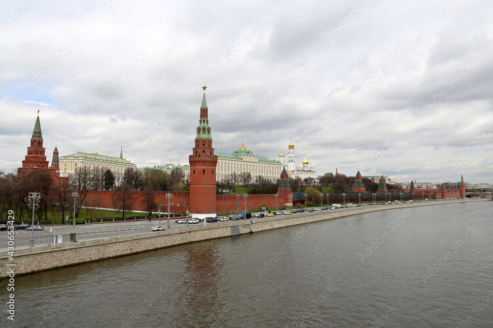 View of the Moscow Kremlin, the Grand Kremlin Palace and Moscow river on cloudy sky background. Scenic city panorama, russian tourist landmark