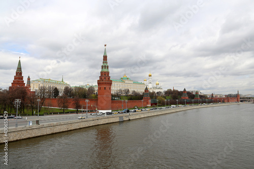 View of the Moscow Kremlin, the Grand Kremlin Palace and Moscow river on cloudy sky background. Scenic city panorama, russian tourist landmark