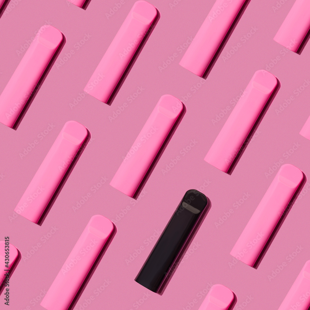 © Александр Терехов - Colorful pattern disposable electronic cigarette pod on a rose background. alternative to modern smoking, vaping and nicotine. tobacco substitution and black part © Александр Терехов - Colorful pattern disposable electronic cigarette pod on a rose background. alternative to modern smoking, vaping and nicotine. tobacco substitution and black part