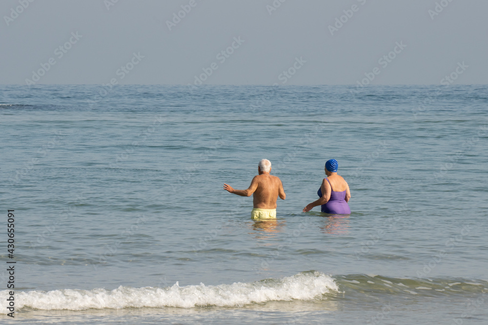 An Elderly Couple Going for a Swim