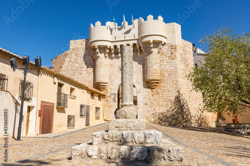 a broken stone pillory in front of Puerta de Santa Maria gate in Hita town, province of Guadalajara, Castile La Mancha, Spain photo