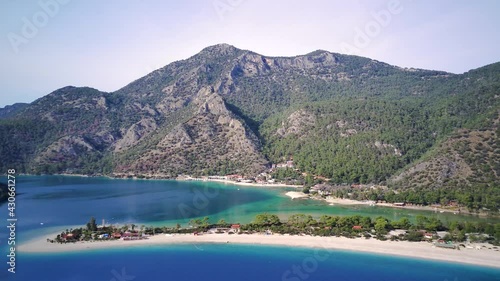 Amazing high angle top drone view on world famous paragliding and parasailing turkish spot for extrim parachute sport in Oludeniz in Fethiye, Turkey
