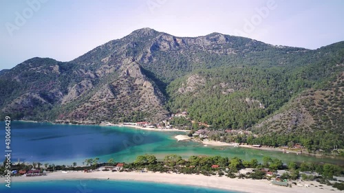 Amazing high angle top drone view on world famous paragliding and parasailing turkish spot for extrim parachute sport in Oludeniz in Fethiye, Turkey
