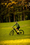 Young man riding ebike in the park