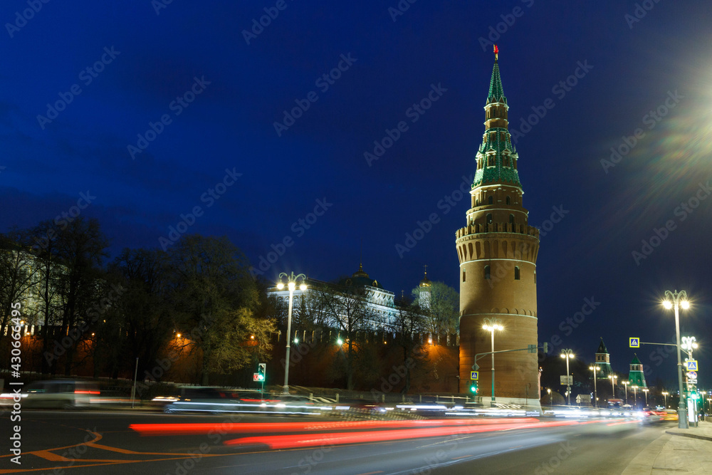 Moscow, Russia.  Kremlevskaya embankment and Vodovzvodnaya tower of the Moscow Kremlin. Night. Car traces. Long exposure