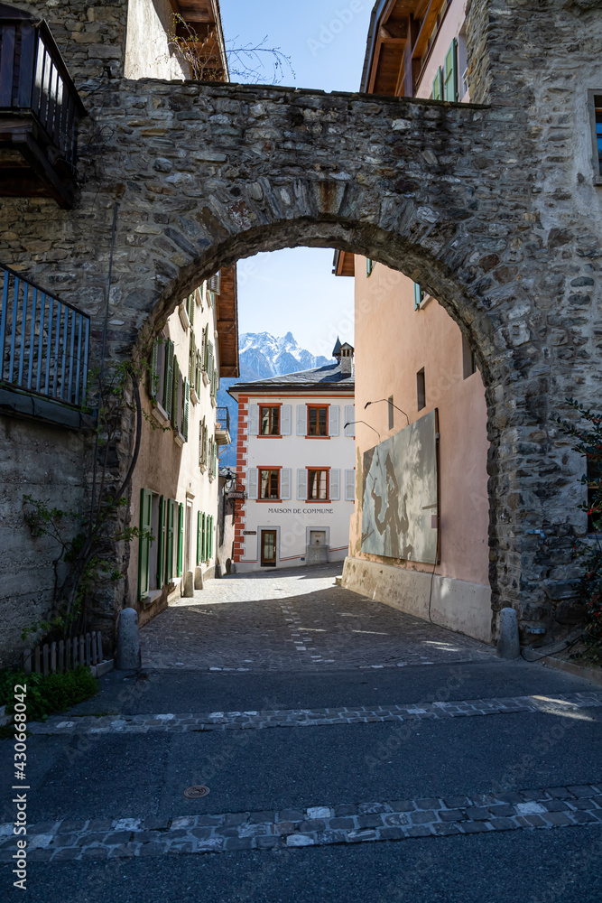 Saillon, Switzerland 28.03.2021 - arch in the Village of Saillon in Spring, Maison Commune, Pierre Avoi, Farinet hike