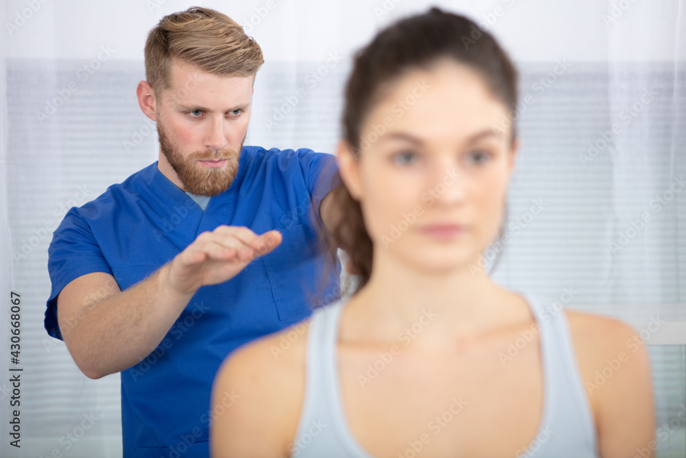 physiotherapist working with patient in clinic physiotherapist working with patient in clinic