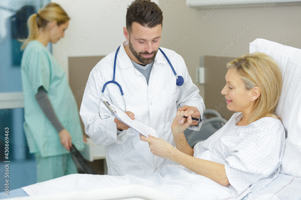 © auremar - doctor telling his female patient the results of her tests © auremar - doctor telling his female patient the results of her tests