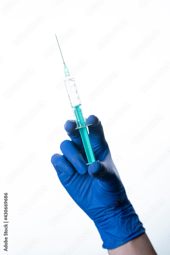 doctor wearing gloves holding syringe doctor wearing gloves holding syringe