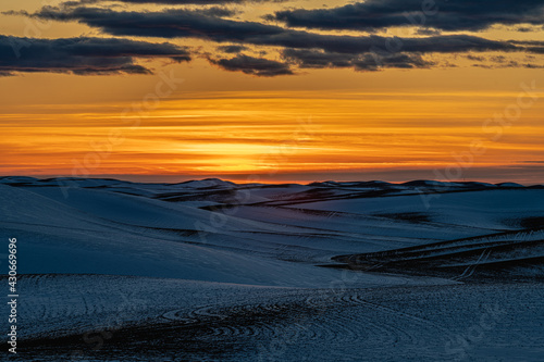 Sunset over Snow Covered Fields