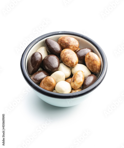 Sweet chocolate almonds. Chocolate eggs in bowl.