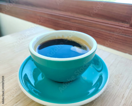 A cup of hot coffee.