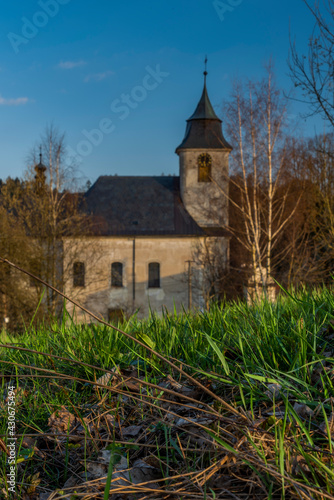 View for Roprachtice village with old church in spring nice sunny evening