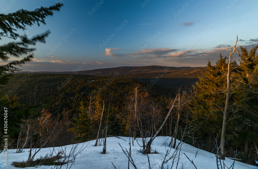 Sunset view from Bukovec hill with blue sky and orange sun Sunset view from Bukovec hill with blue sky and orange sun