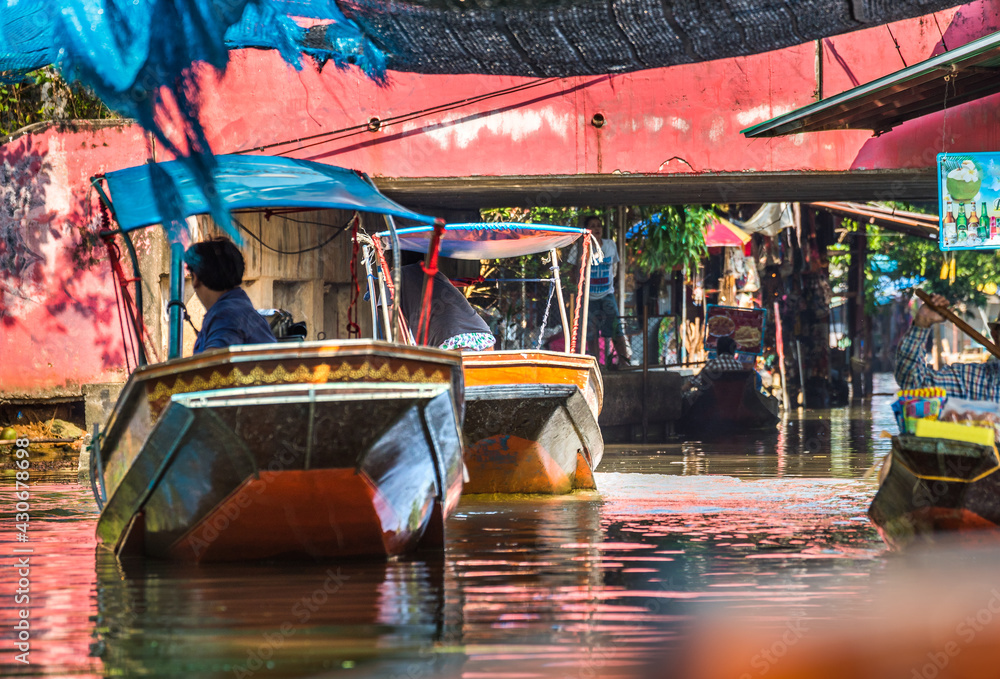 Famous Floating Market in Thailand, Damnoen Saduak Floating Market, Local People and Tourists Visiting by Boat, Ratchaburi, Thailand.