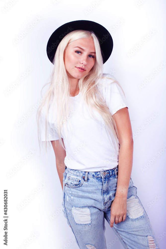 young pretty blond girl hipster in hat on white background casual close up dreaming smiling posing cheerful, lifestyle people concept young pretty blond girl hipster in hat on white background casual close up dreaming smiling posing cheerful, lifestyle people concept
