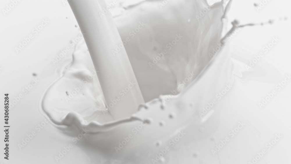Super Slow Motion Shot of Pouring and Splashing Fresh Milk at 1000 fps. Super Slow Motion Shot of Pouring and Splashing Fresh Milk at 1000 fps.