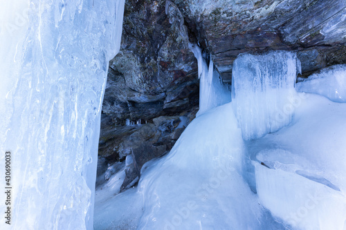 Ice cave called Iskjørkja on the Tromsaelva River, near the village of Fåvang, Norway photo