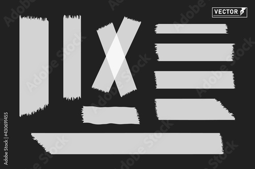 Sticky gray torn tape. Sticky strips for the office. Objects on an isolated dark background.
