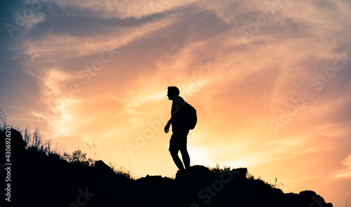 silhouette of man on a mountain 