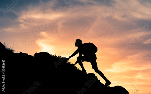 Man climbing hiking up mountain 