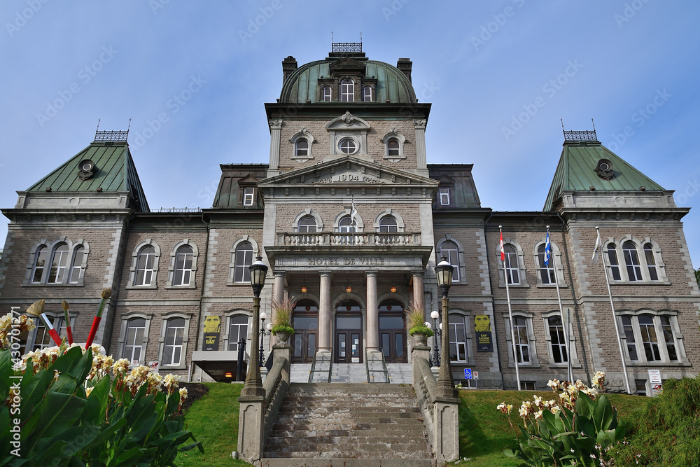 Townhall historical building. Sherbrooke, Quebec city hall front view. Green copper roof details
