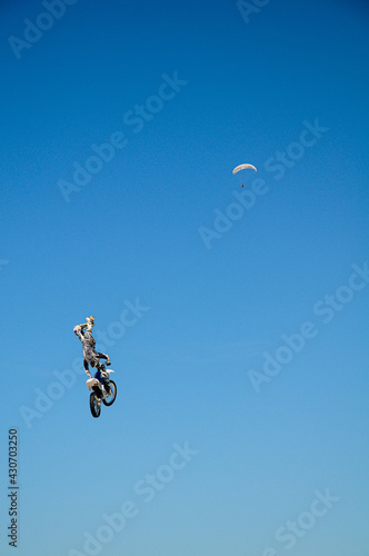 Motocross free style meets hang glide.
