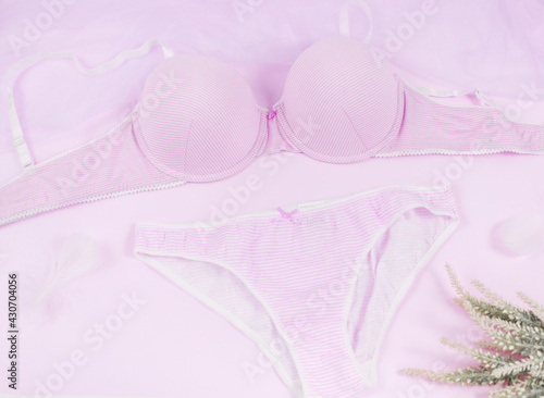 violet modern lady essentials: bra and cotton panty. Fashionable lingerie, female underwear. Lace gentle panties and bra on pastel violet background. Beauty, fashion, blogger, social media content 