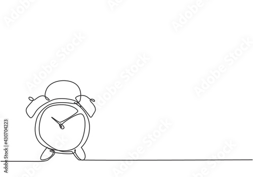 Single continuous line drawing of old retro alarm analog clock on the floor. Minimalism metaphor business deadline concept. Dynamic one line draw graphic design vector illustration