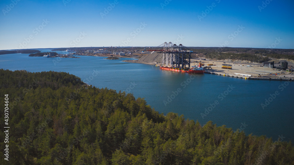Stockholm Norvik Port, Sweden, 2020-03-18: Aerial view of installing new cranes, shipped from China to Sweden. High quality photo