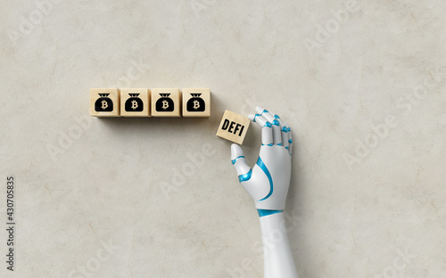 robot hand adding a cube with the message DEFI to four others with bitcoin symbols on concrete background © fotogestoeber