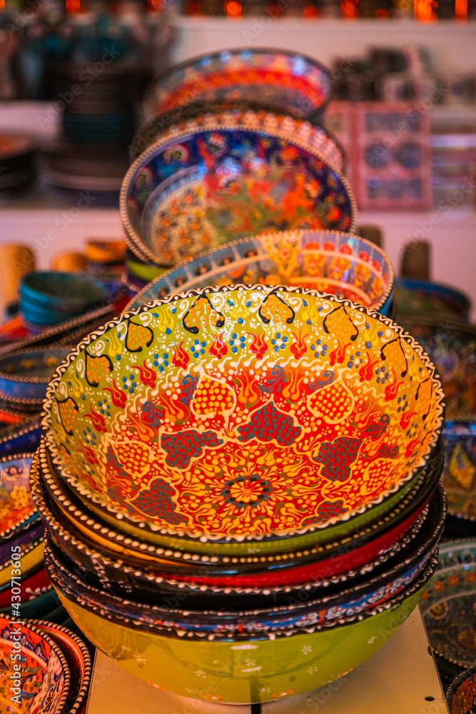 Classical Turkish ceramics on the Istanbul Grand Bazaar. Colorful ceramic plates for sale in Turkey. Decorated tableware in the tourist store. souvenir shop Classical Turkish ceramics on the Istanbul Grand Bazaar. Colorful ceramic plates for sale in Turkey. Decorated tableware in the tourist store. souvenir shop