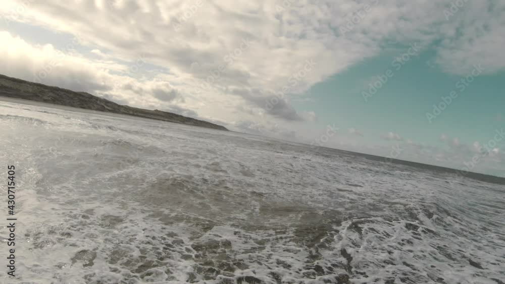 Low Aerial Towards Foamy Seascape At The Beach Of Texel Island In North Holland, Netherlands. - Drone, POV, FPV Low Aerial Towards Foamy Seascape At The Beach Of Texel Island In North Holland, Netherlands. - Drone, POV, FPV