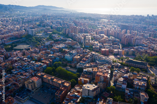 Aerial view of Santa Coloma de Gramenet with a apartment buildings and Besos river, Spain